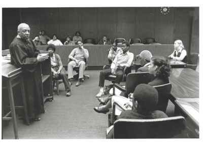 The late Judge Clifford Scott Green, LEAP's early champion, talks to Philadelphia students (can anyone identify the school) as then LEAP Executive Director Beth Farnbach looks on.